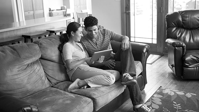 Image of a man and a woman looking at a tablet computer