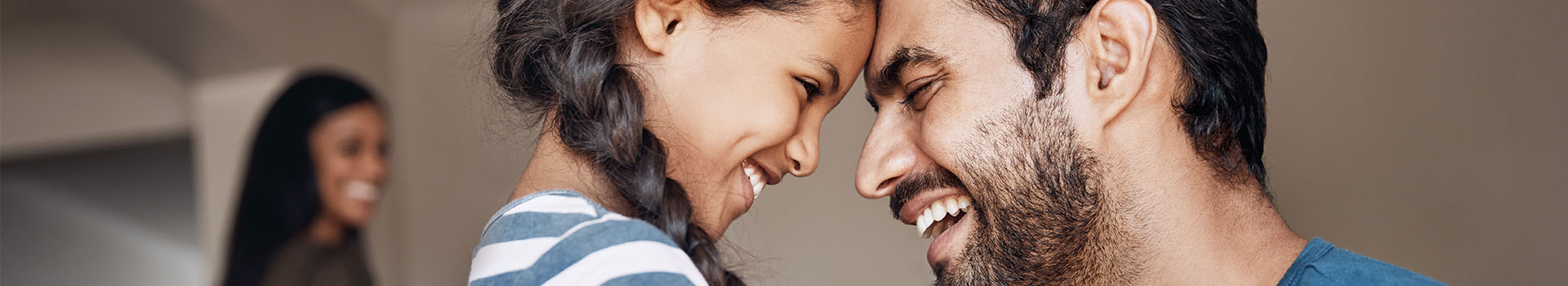 Image of a man and a girl laughing together